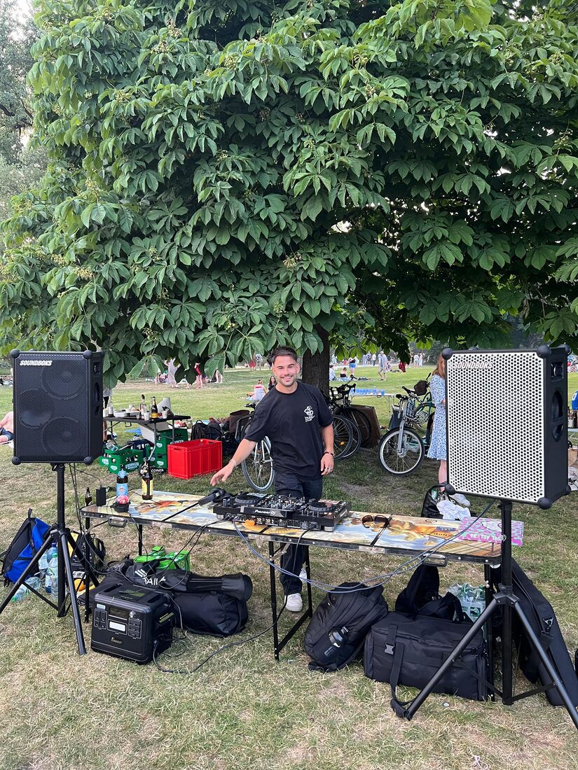George DJing outdoors at an early Momentum session